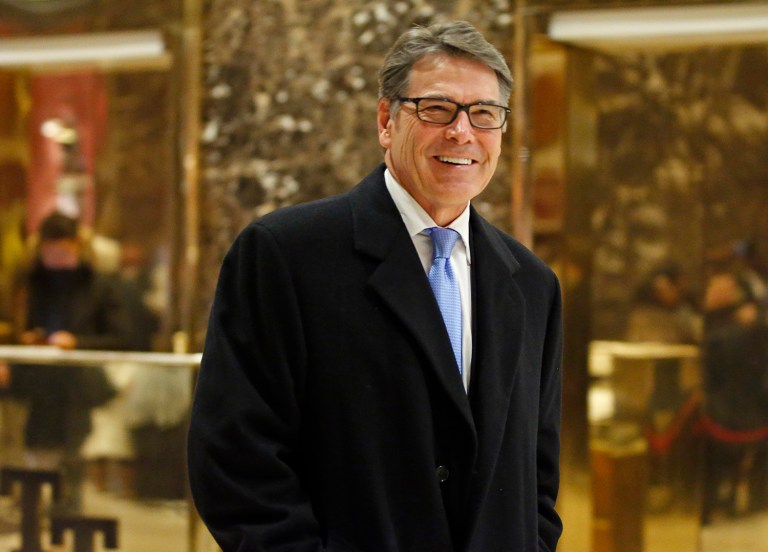 Former Texas Gov. Rick Perry smiles as he leaves Trump Tower, Monday, Dec. 12, 2016, in New York. (AP Photo/Kathy Willens)