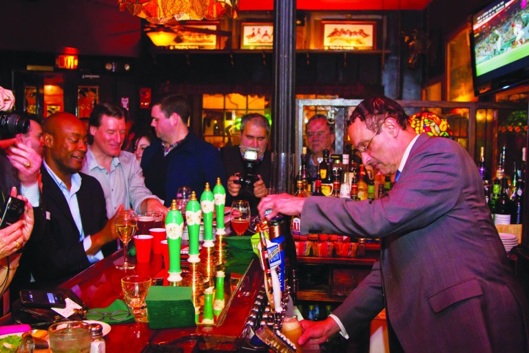 Courtesy of Peter Stepanek
Mayor Vincent Gray pours beer at Martin's Tavern in Georgetown.