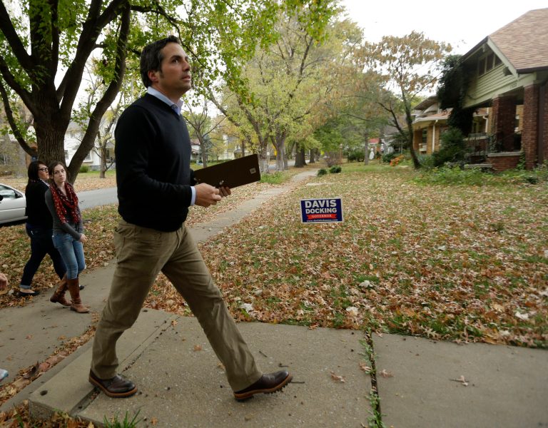 Independent Kansas Senate candidate Greg Orman canvasses a neighborhood Monday in Topeka, Kan.