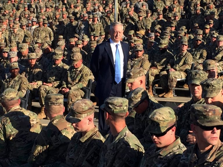 FILE - In this Dec. 21, 2017, file photo Defense Secretary Jim Mattis talks to troops at an outdoor movie theater at Guantanamo Bay, Cuba. Mattis is a storyteller, and nowhere do the tales flow more easily than when he's among the breed he identifies with most closely _ the men and women of the military (AP Photo/Robert Burns, File)