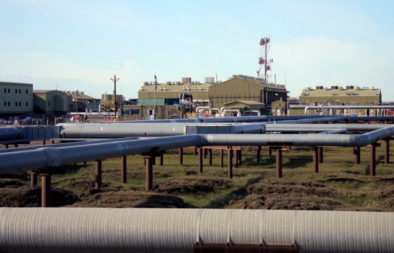 Oil and gas pipelines run into Alyeska's trans-Alaska oil pipeline pump station one on Alaska's North Slope Saturday, Aug. 5, 2006, near Deadhorse, Alaska. (AP Photo/Al Grillo)