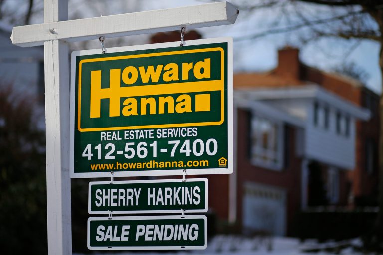 FILE - In this  Thursday, Jan. 9, 2014, file photo, a for sale sign with a sale pending hangs in front of a house in Mount Lebanon, Pa. The National Association of Realtors reports on the number of Americans who signed contracts to buy homes in January on Friday, Feb. 28, 2014. (AP Photo/Gene J. Puskar)
