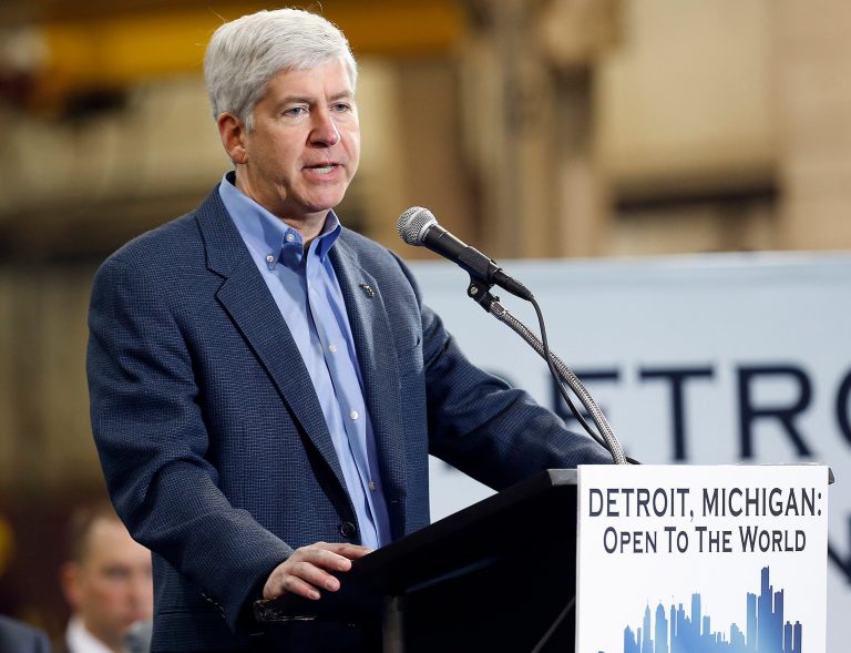Michigan Gov. Rick Snyder speaks at the IDEAL Group Thursday, Jan. 23, 2014 in Detroit. Snyder announced a plan to ask the Obama administration to set aside thousands of work visas to entice talented immigrants to live and work in bankrupt Detroit. The Republican governor said he is seeking 50,000 work visas solely for the city over five years. (AP Photo/Paul Sancya)