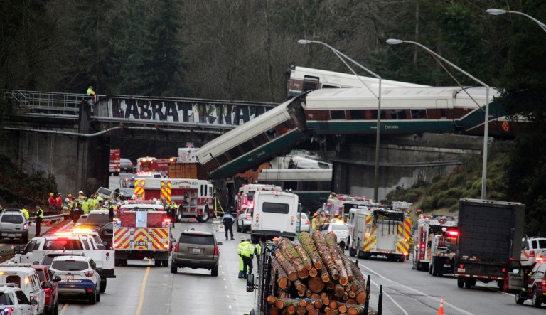 An Amtrak train making an inaugural run on a new route derailed south of Seattle on Monday, spilling train cars onto a busy Interstate 5 in an accident that resulted in 