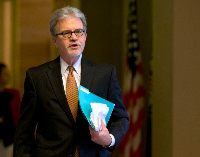 Sen. Tom Coburn, R-Okla., cut up a giant poster of a credit card on the Senate floor Tuesday, saying it demonstrated why Washington politicians must end their addiction to spending money they don't have. (AP Photo)