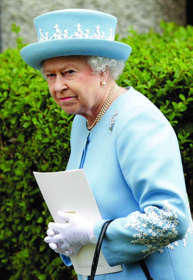 Britain's Queen Elizabeth II arrives for a Service of Thanksgiving in Saint Macartin's Cathedral in Enniskillen, Northern Ireland, Tuesday, June 26, 2012. The Queen and the Duke of Edinburgh arrived in Northern Ireland for a two day visit to mark the Queen's Diamond Jubilee. (AP Photo/Peter Morrison)