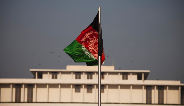 Afghanistan's flag hoisted before the President House flaps in the wind in Islamabad, Pakistan, Thursday, Nov. 13, 2014. Afghan President Ashraf Ghani will make his first state visit in coming days to neighboring Pakistan, long blamed by his predecessor for harboring militants, in hopes of finding a way to revive peace talks with the Taliban. 