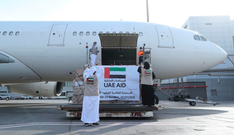 In this Tuesday, May 19, 2020 photo released by the state-run WAM news agency, an Etihad Airways flights loaded with aid for the Palestinians to fight the coronavirus pandemic is loaded in Abu Dhabi, United Arab Emirates. Etihad Airways flew aid for the Palestinians amid the coronavirus pandemic from the capital of the United Arab Emirates into Israel on Tuesday, marking the first known direct commercial flight between the two nations