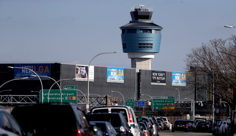 The air traffic control tower at LaGuardia Airport is seen, Friday, Jan. 25, 2019, in New York. The Federal Aviation Administration reported delays in air travel Friday because of a "slight increase in sick leave" at two East Coast air traffic control facilities. 