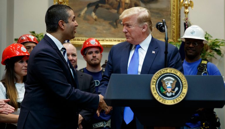 President Donald Trump shakes hands with FCC chairman Ajit Pai during an event on the deployment of 5G technology in the United States, in the Roosevelt Room of the White House, Friday, April 12, 2019, in Washington.