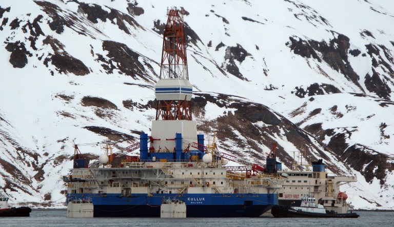 The damaged Royal Shell Dutch drilling barge Kulluk is   loaded onto the transport ship XRK in Unalaska, Alaska, on Tuesday, March 19, 2013.  After the Kulluk is secured, the tow ship will take it to Singapore for repairs.  The Kulluk drilled in the Beaufort Sea last year and was being towed to Seattle when it broke loose from its towing vessel and ran aground on New Year's Eve near Kodiak Island.