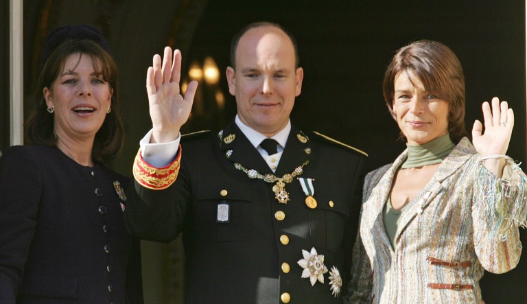 Prince Albert II of Monaco, his sisters Princess Caroline of Hanover, left, and Princess Stephanie of Monaco wave from the Monaco palace, Saturday Nov.19, 2005. Prince Albert II formally assumes Monaco's throne Saturday during a day of ceremony and celebration to usher in the modern-day monarch. festivities coincides with Monaco's national day.