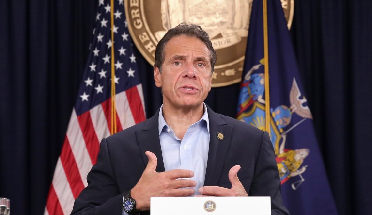 Actresses Mira Sorvino, right, and Julianne Moore look on as New York Gov. Andrew Cuomo speaks before signing a bill that increases the statute of limitations in rape cases during a bill signing ceremony in New York, Wednesday, Sept. 18, 2019. The actresses were there as supporters of the bill and as members of the Time's Up movement, which advocates for women's rights.