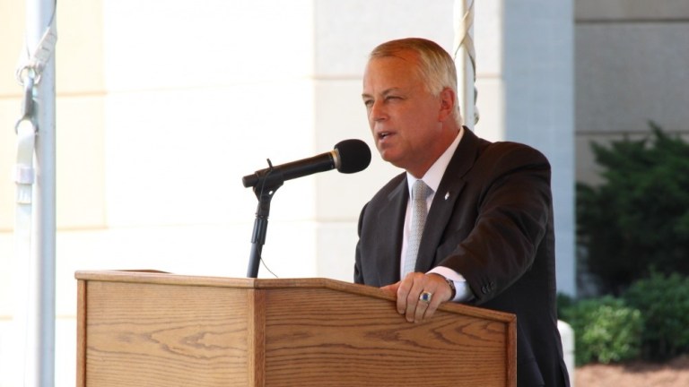 Secretary of the North Carolina Department of Transportation Tony Tata, speaks at the unveiling of the Airborne and Special Operations highway dedication sign hosted at the Airborne and Special Operations Museum in downtown Fayetteville, N.C., Aug. 16, 2014.