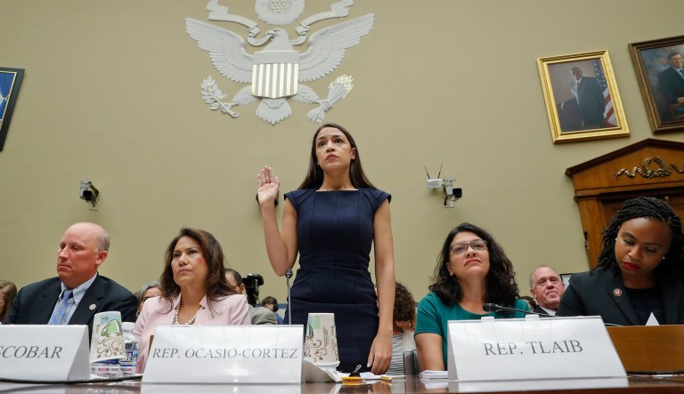 Rep. Alexandria Ocasio-Cortez, D-NY., center, is sworn-in before testifying before the House Oversight Committee hearing on family separation and detention centers, Friday, July 12, 2019 on Capitol Hill in Washington.