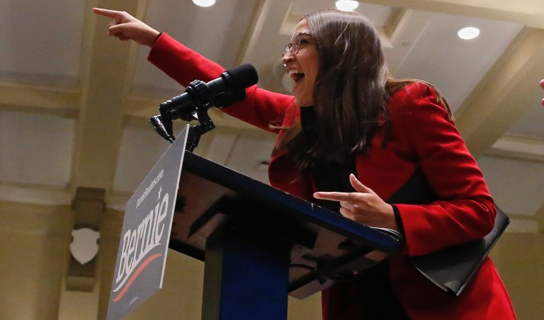 Rep Alexandria Ocasio-Cortez, D-N.Y., greets the crowd as she arrives to speak as a surrogate for Democratic Presidential Candidate Bernie Sanders Friday, Jan.24, 2020, in Iowa City, Iowa.