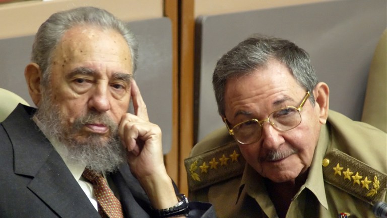 Cuban President Fidel Castro, left, and his brother, Minister of Defense Raul Castro, attend a Cuban Parliament session in the Palace of Conventions.