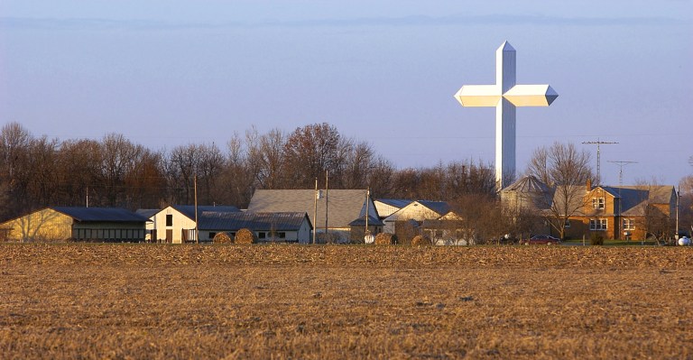 The Effingham cross towers over the town of Effingham, Ill. It's depiction in a mural has come under fire.