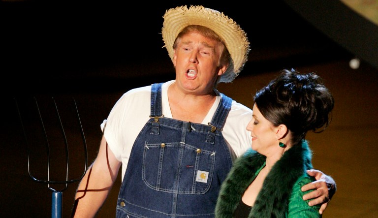 Donald Trump does a parody of television theme songs with Megan Mullally, of the comedy series "Will & Grace," during the 57th Annual Primetime Emmy Awards Sunday, Sept. 18, 2005, at the Shrine Auditorium in Los Angeles. 