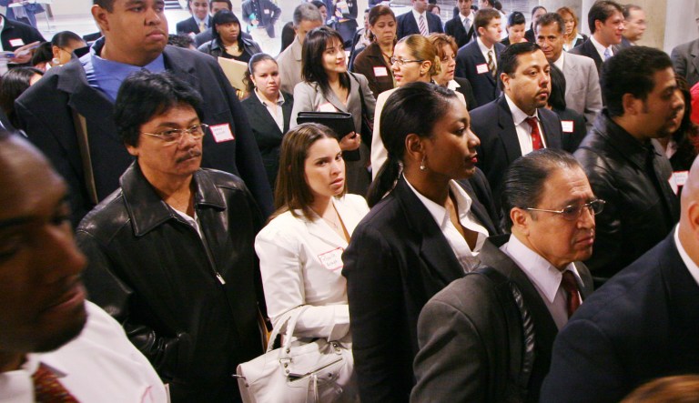 Attendees to a job fair sponsored by the Hispanic Alliance for Career Enhancement file into the Jacob Javits Convention Center. The Labor Department will issue unemployment figures. 
