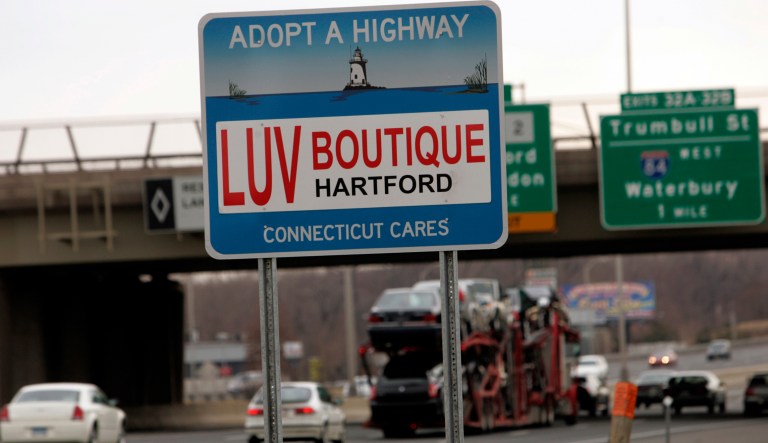 This is one of four of the state's "Adopt-A-Highway" signs as seen Thursday, Feb. 26, 2009 that has been rented to The LUV Boutique,a small chain of adult entertainment stores, as seen on the southbound side of Interstate-91 outside of Hartford, Conn.
