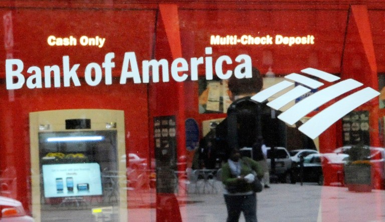 A customer uses an ATM machine at a Bank of America branch office in Boston.