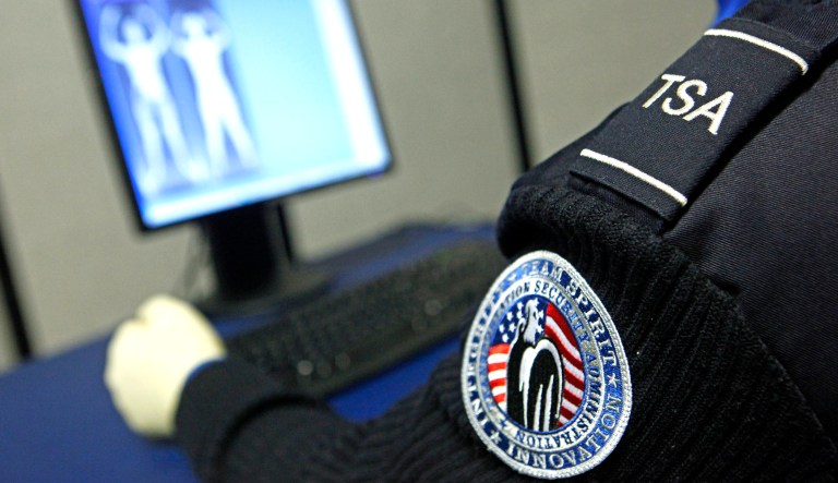 A Transportation Security Administration officer views a full-body scan.