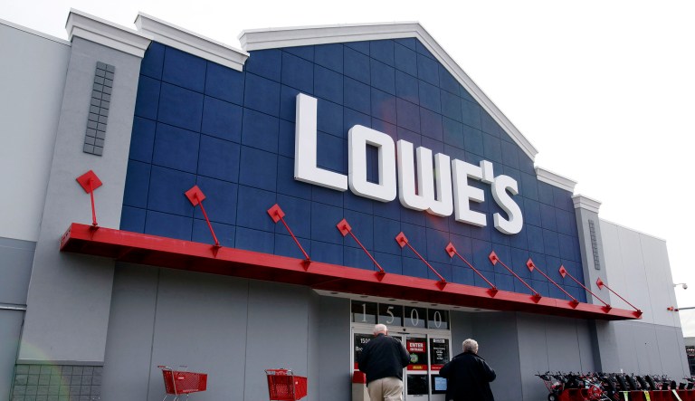 Customers walk toward the Lowe's store in Saugus, Mass.