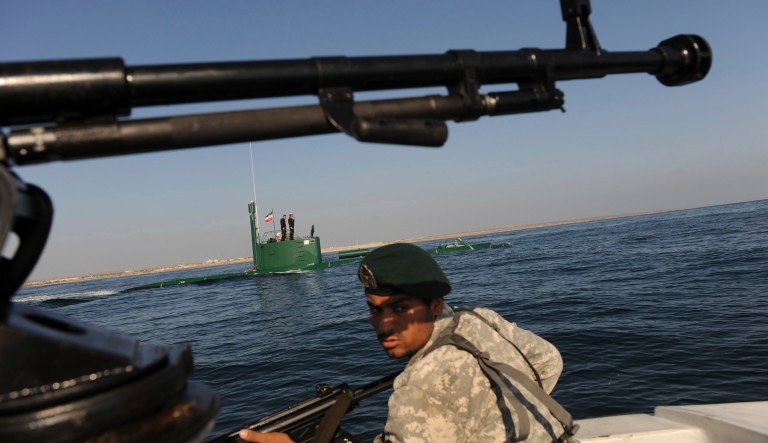 Members of the Iran Navy participate in a drill Wednesday, Dec. 28, 2011 in the Sea of Oman. Iran's navy chief warned Wednesday that his country can easily close the strategic Strait of Hormuz at the mouth of the Persian Gulf, the passageway through which a sixth of the world's oil flows. The navy is in the midst of a 10-day drill in international waters near the strategic oil route.  