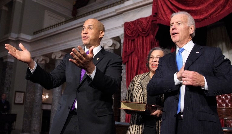 Sen. Cory Booker is seen on the left; Joe Biden is seen on the right.