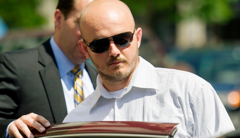 In this 2014 file photo, former Blackwater Worldwide guard Nicholas Slatten enters a taxi cab as he leaves federal court in Washington, after the start of his trial.