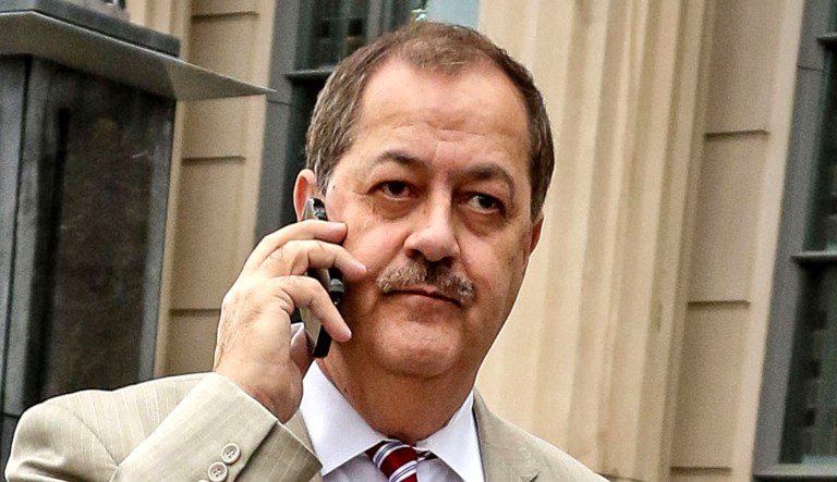 Former Massey Energy CEO Don Blankenship makes his way out of a building.