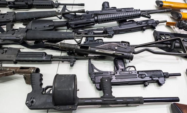 Some of the weapons collected at Los Angeles Gun Buyback event are showcased Thursday, Dec. 27, 2012 during a news conference at the LAPD headquarters in Los Angeles. 