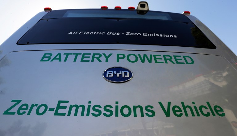 FILE - In this May 1, 2013, file photo, an electric bus produced by China's BYD Co., is parked at the announcement of the opening of an electric bus manufacturing plant in Lancaster, Calif. The Chinese automaker that sold more electric cars last year than Tesla, Nissan and GM combined is taking a back road into the American market on a battery-powered bus.