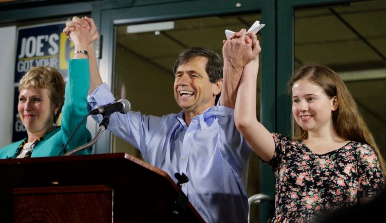 Former Congressman Joe Sestak, center, his wife Susan Sestak, left, and daughter Alex Sestak react after speaking to supporters gathered outside his campaign headquarters, Tuesday, April 26, 2016, in Media, Pa. 