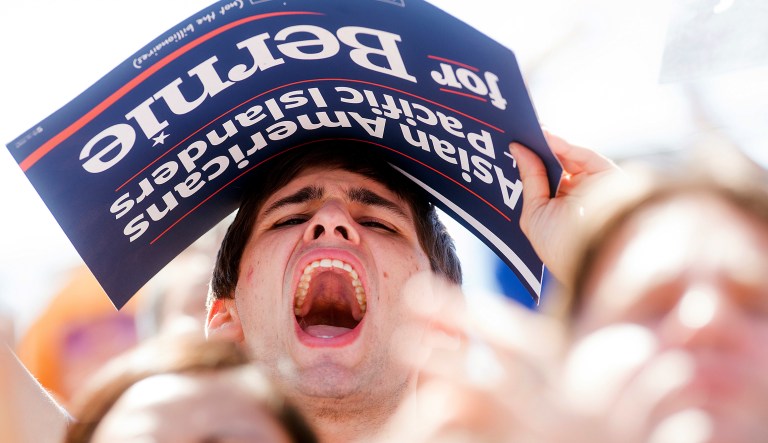 College student Eddie Cisneros cheers for Democratic presidential candidate Sen. Bernie Sanders, I-Vt., during a campaign rally at the Cubberley Community Center on Wednesday, June 1, 2016, in Palo Alto, Calif. 