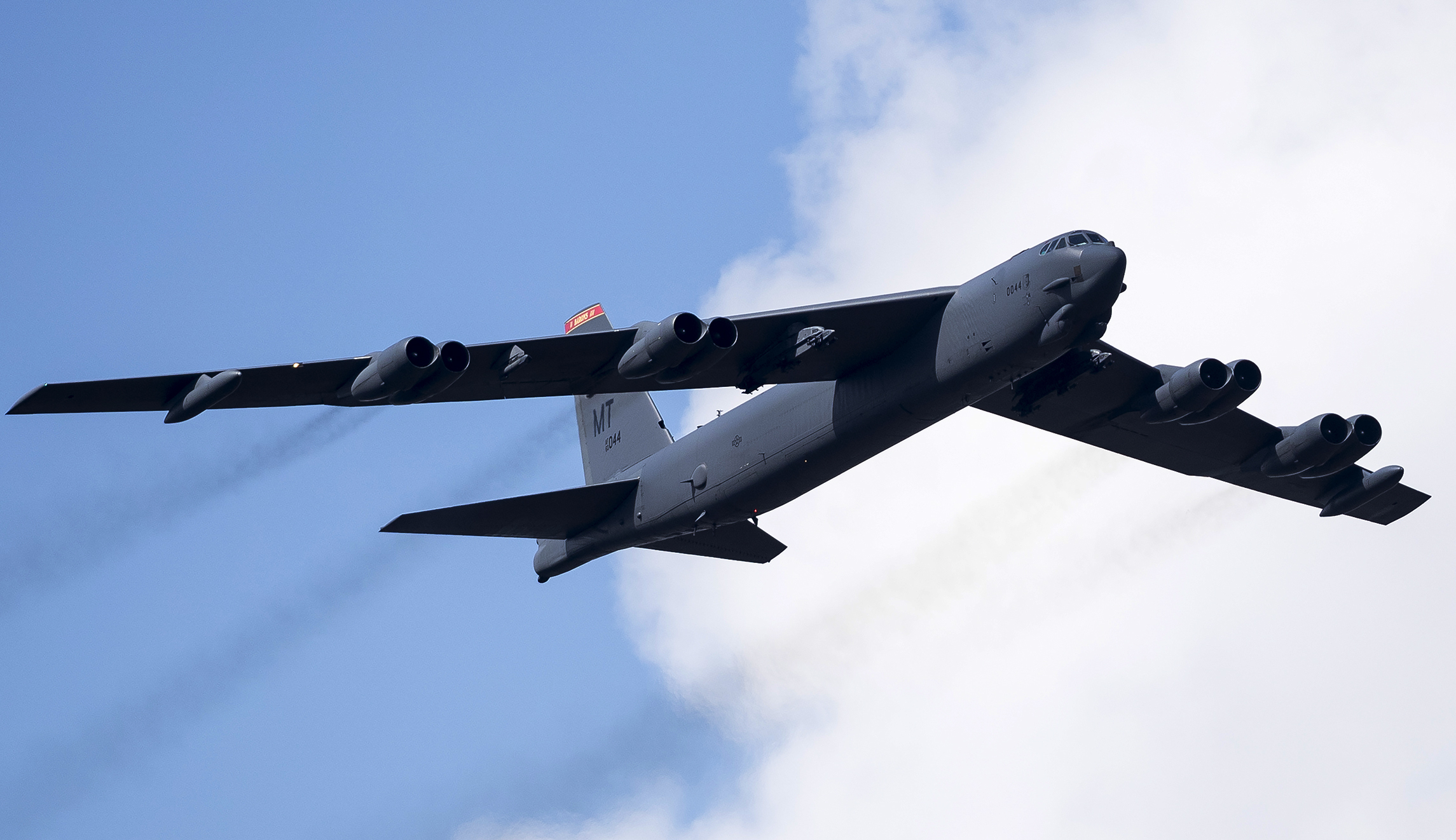 A U.S. Air Force B-52 bomber flies in the sky.