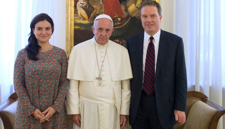 Pope Francis poses for a family picture with Greg Burke and Paloma Garcia Ovejero at the Vatican, Monday, July 11, 2016. Pope Francis has named a former Fox TV correspondent, Greg Burke, to replace his longtime spokesman and tapped Paloma Garcia Ovejero, of Spain, to be his deputy, the first time a woman has held the post.