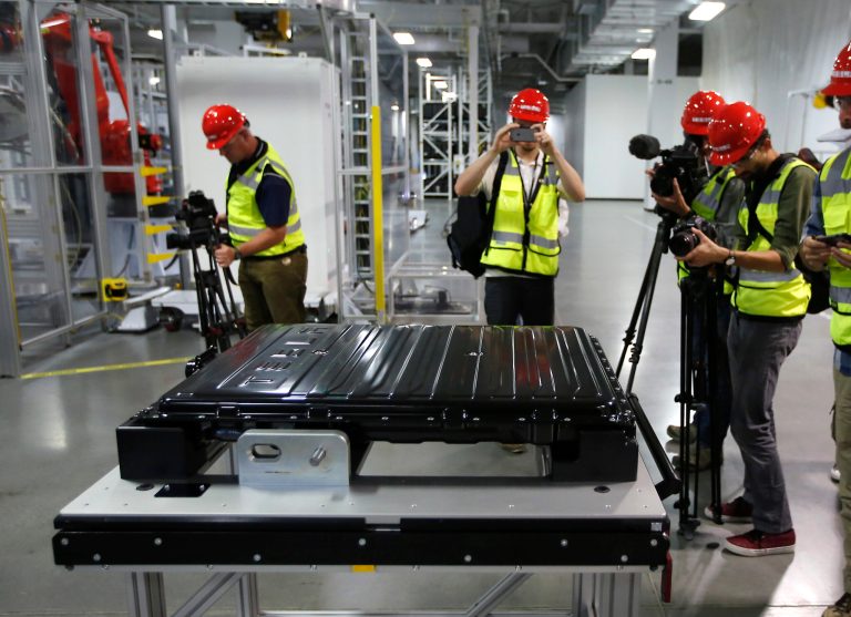 A Tesla battery pack is displayed during a media tour of the new Tesla Motors Inc., Gigafactory Tuesday, July 26, 2016, in Sparks, Nev. It's Tesla Motors biggest bet yet: a massive, $5 billion factory in the Nevada desert that could almost double the world's production of lithium-ion batteries by 2018. 