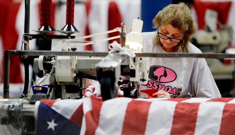 Lennis Waller sews United States flags at Annin Flagmakers in South Boston, Va.