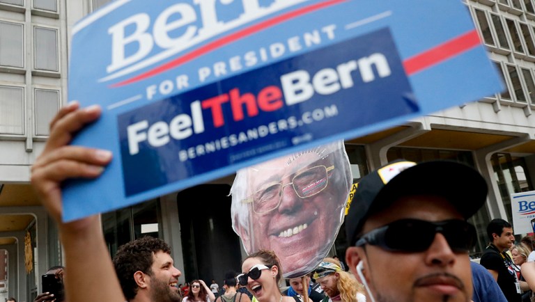 Supporters of Sen. Bernie Sanders, I-Vt., hold up signs during a rally in Philadelphia.