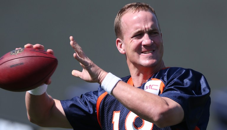 Peyton Manning throws a football during a drill.