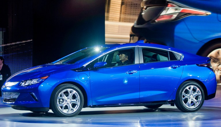 FILE - In this Jan. 12, 2015, file photo, the 2016 Chevrolet Volt hybrid car is presented at the North American International Auto Show, in Detroit. The 2016 Chevrolet Volt is more efficient than ever, going farther on its electric power and farther on a tank of gasoline all while getting a price cut. The five-door hatchback also is restyled for a mainstream Chevy look and has a nicer, quieter interior. 