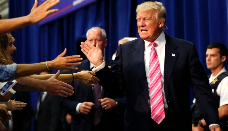 Republican presidential candidate Donald Trump greets the crowd as he arrives to speak at a campaign rally in Fredericksburg, Va., Saturday, Aug. 20, 2016. 