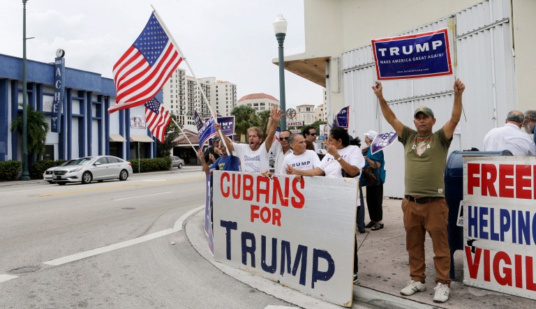 A group of Cuban-Americans chant pro Trump slogans as they demonstrate their support for Republican presidential candidate Donald Trump, Friday, Oct. 28, 2016, in Miami.