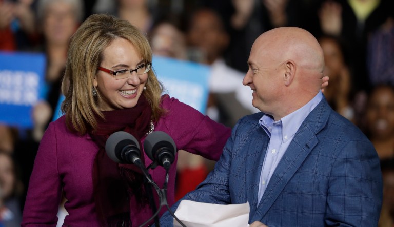 Former Arizona Rep. Gabby Giffords and her husband Mark Kelly campaign for Democratic presidential candidate Hillary Clinton at the base of the John A. Roebling Suspension Bridge in Cincinnati, Monday, Oct. 31, 2016. 