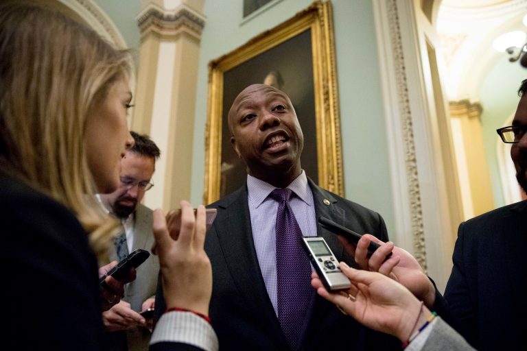 Sen. Tim Scott, R-S.C. speaks to members of the media as he arrives for a closed-door Republican policy luncheon on Capitol Hill in Washington, Wednesday, Nov. 16, 2016.