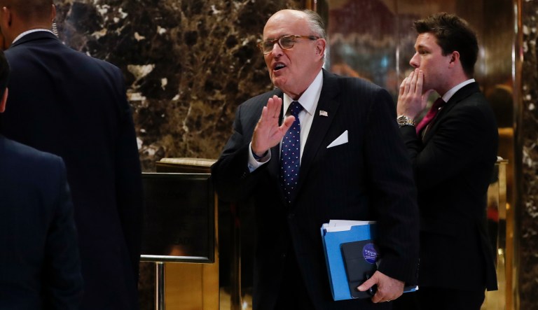Former New York Mayor Rudy Giuliani calls out to media as he arrives at Trump Tower, Wednesday, Nov. 16, 2016, in New York.