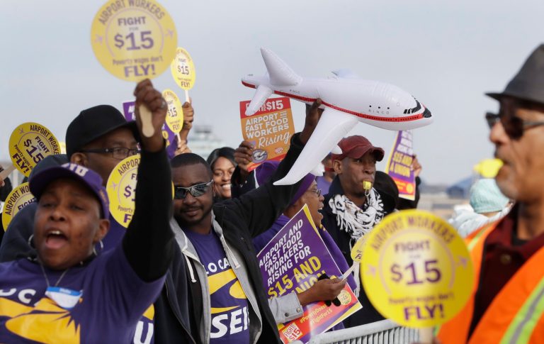 SEIU Local 1 union members protest for an increase in the minimum wage on Nov. 29, 2016, at the Detroit Metropolitan Airport in Romulus, Mich.