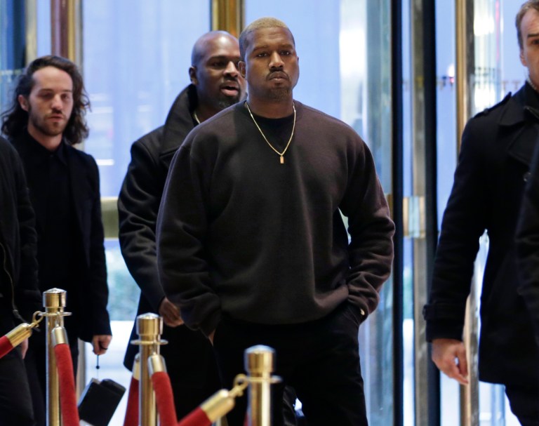 In this 2016 photo, rapper Kanye West enters Trump Tower in New York.